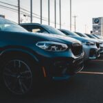 a row of cars parked in a parking lot