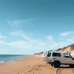 a van parked on a beach